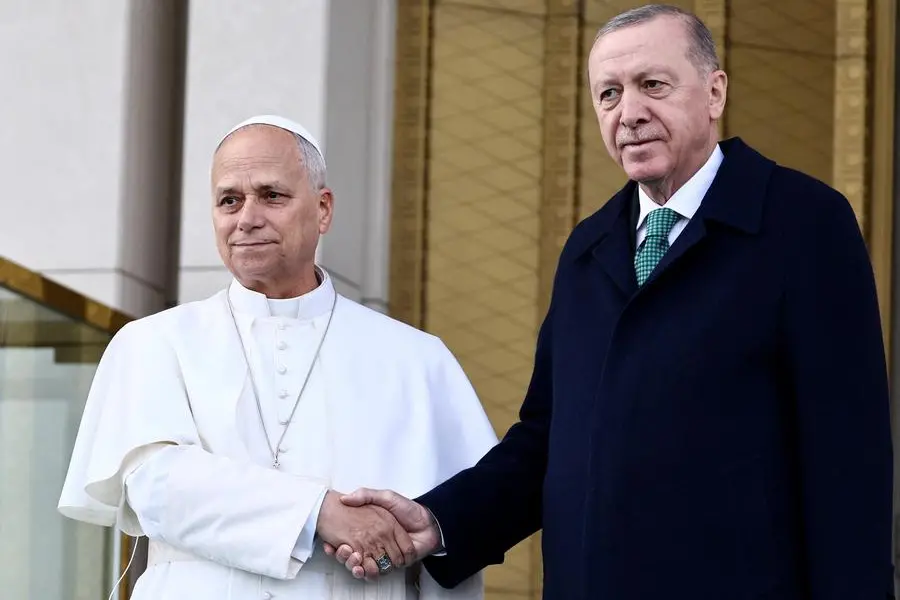 Pope Leo XIV shakes hands with Turkish President Tayyip Erdogan at the Presidential Palace, during his first apostolic journey, in Ankara, Turkey, November 27, 2025. , REUTERS