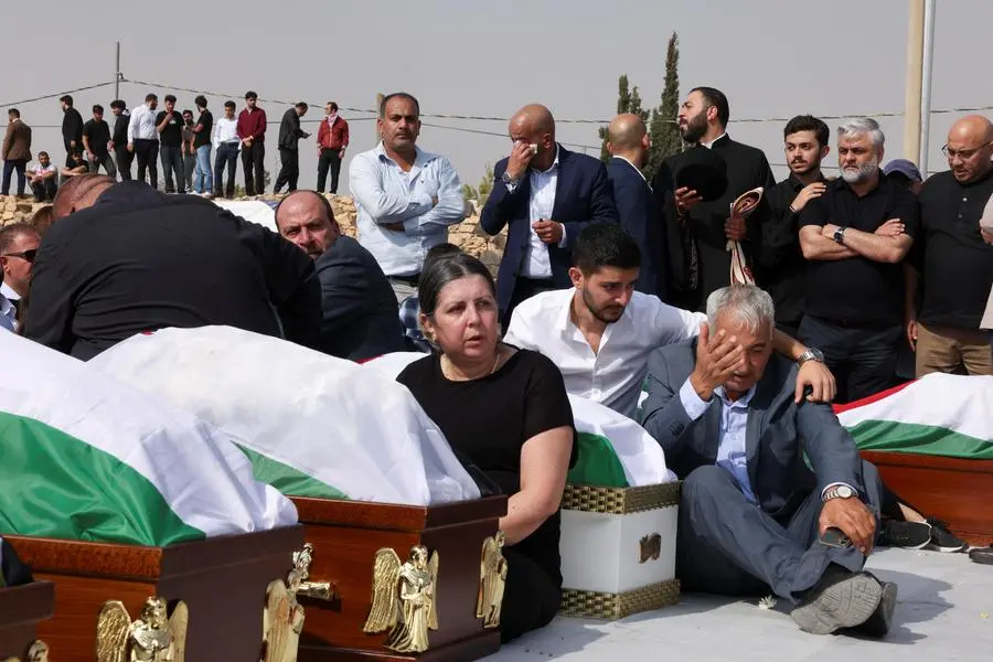 I funerali delle vittime dell\\'attentato terroristico a Karak in Giordania. , REUTERS
