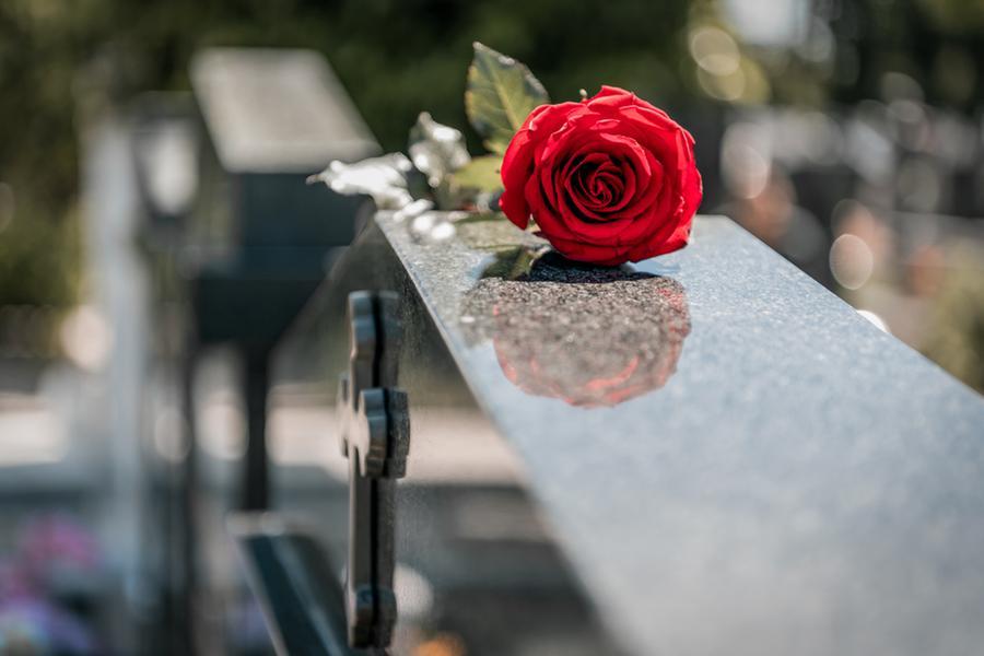 A gravestone for Massimo, who died alone on a bench A gravestone for Massimo, who died alone on a bench