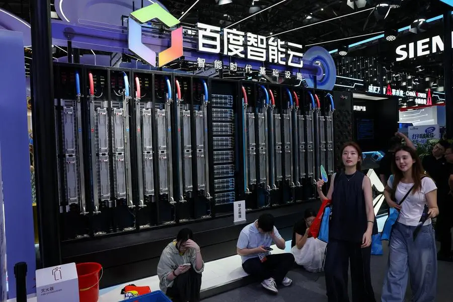 Visitors walk past the Baidu booth, where the Baidu Intelligent Cloud Tianchi 512 Supernodes system is on display, during the World Artificial Intelligence Conference (WAIC), in Shanghai, China, on July 18