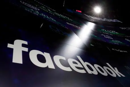FILE - In this March 29, 2018, file photo, the logo for Facebook appears on screens at the Nasdaq MarketSite in New York's Times Square. Facebook CEO Mark Zuckerberg is set to testify before a House oversight panel on April 11 as Congress and U.S. regulators consider how to deal with the social media giant amid a privacy scandal. (ANSA/AP Photo/Richard Drew, File)