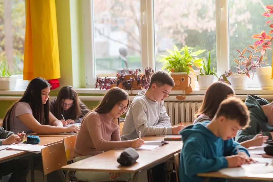 students take a test in the classroom , iStock