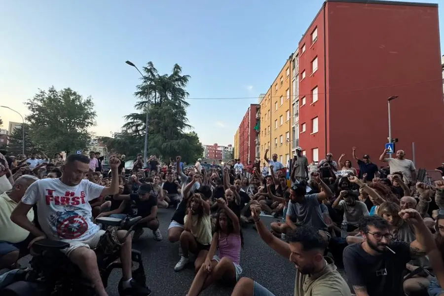 Fists raised for the death of Abderrahim Fakir during the protest at the Pilastro in Bologna