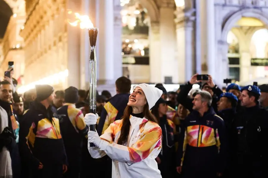 epa12707635 Italian ballet dancer Nicoletta Manni carries the Olympic torch during its final leg in Milan\\'s cathedral square, one day before the opening ceremony of the Milano Cortina 2026 Winter Olympic Games, in Milan, Italy, 05 February 2026. The 2026 Winter Olympics will kick off with the opening ceremony on 06 February 2026. EPA/TERESA SUAREZ , EPA