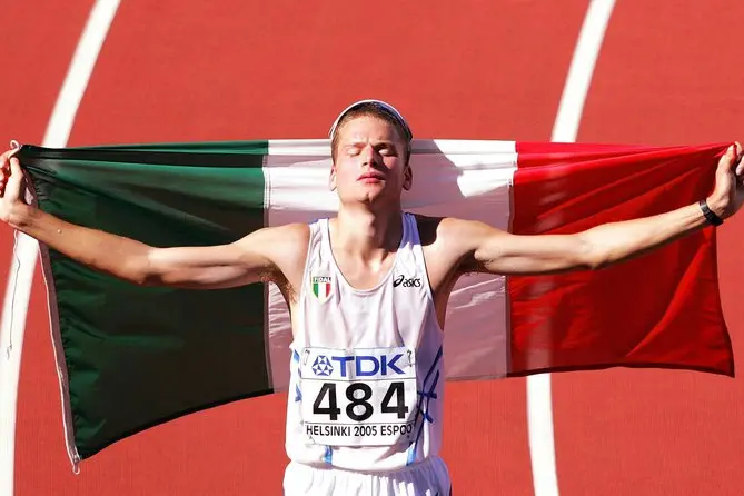 Italian Alex Schwarzer celebrates placing third in the 50km Walk at the 10th IAAF World Championships in Athletics, Helsinki, Finland, Friday 12 August 2005. ANSA/FABRICE COFFRINI