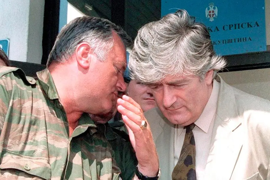 epa12226454 (FILE) - Republika Srpska leader Radovan Karadzic (R) listens to VRS Commander Ratko Mladic (L) during a meeting in Pale, Bosnia and Herzegovina, 05 August 1993 (reissued 09 July 2025). The UN General Assembly designated 11 July as the International Day of Reflection and Commemoration for the 1995 Genocide in Srebrenica perpetrated by the Bosnian Serb army. The massacre led to the killing of at least 8,372 men and boys, the displacement of thousands, and the destruction of entire communities in Srebrenica, which had been designated a “safe area” by the UN Security Council. EPA/Stringer *** Local Caption *** 56198063