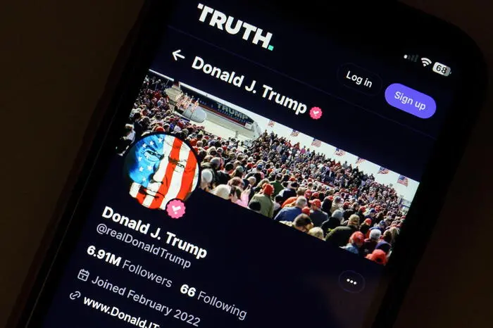epa11255981 A photo illustration of former US President Donald Trump's account on social media platform Truth Social shown on a mobile phone in Washington, DC, USA, 02 April 2024. Stock in the parent company, Trump Media and Technology Group, fell sharply in the last 48 hrs after the organisation reported loses of $58 million last year. EPA/WILL OLIVER