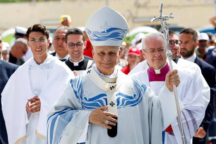 Pope Leo takes part in a procession to celebrate Holy Mass, as he visits the island of Lampedusa, a key entry point for migrants crossing the Mediterranean Sea, during a pastoral trip, Italy, July 4, 2026. REUTERS/Remo Casilli