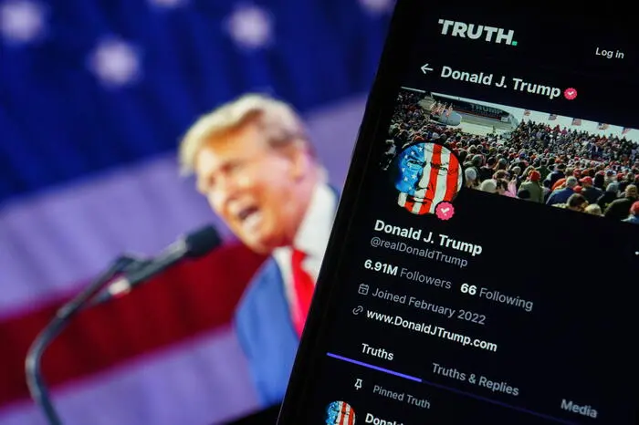 epa11255982 A photo illustration of former US President Donald Trump's account on social media platform Truth Social shown on a mobile phone in Washington, DC, USA, 02 April 2024. Stock in the parent company, Trump Media and Technology Group, fell sharply in the last 48 hrs after the organisation reported loses of $58 million last year. EPA/WILL OLIVER