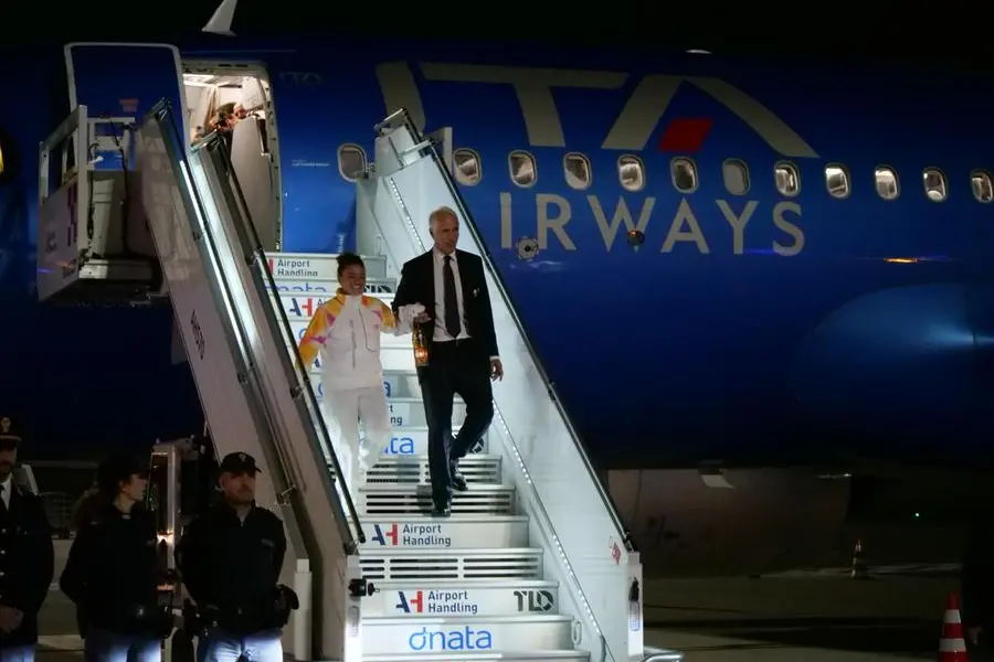 Olympic tennis champion Jasmine Paolini and the president of the Milano-Cortina Foundation, Giovanni Malagò, landed at Fiumicino Airport (Rome) with the Milan-Cortina Olympic flame, Rome, December 4, 2025. ANSA/TELENEWS