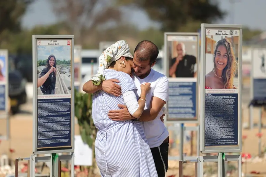 epa13280581 People react as they visit the Re'im memorial site for victims of the Nova music festival near the Gaza border in southern Israel, 04 October 2026. Israel marks three years since the Hamas-led October 7, 2023 attacks. EPA/ABIR SULTAN
