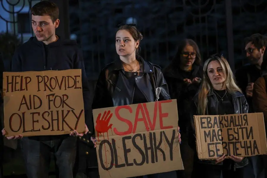 Manifestazione a Kyiv lo scorso 6 ottobre per chiedere l\\'evacuazione in sicurezza e aiuti umanitari per gli abitanti di Oleshky. , REUTERS