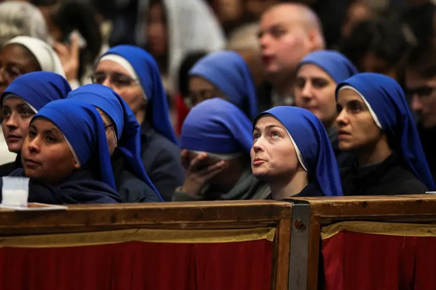 A nun looks up on the day of a Mass celebrated by Pope Leo XIV marking the Catholic feast of the Presentation of Jesus in St. Peter's Basilica at the Vatican, February 2, 2026. REUTERS/Vincenzo Livieri