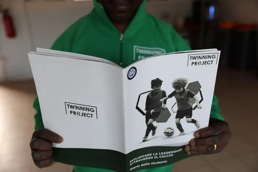 A boy with the project brochure