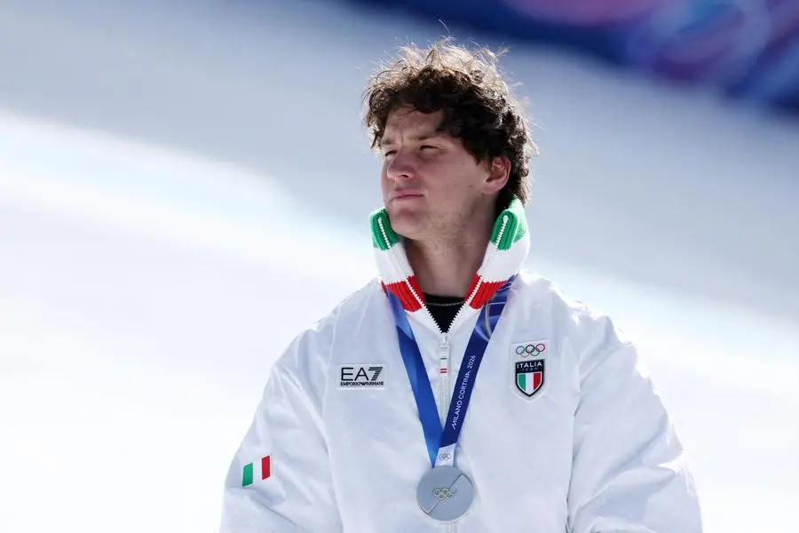 Milano Cortina 2026 Olympics - Alpine Skiing - Men's Downhill Victory Ceremony - Stelvio Ski Centre, Bormio, Italy - February 07, 2026. Silver medalist Giovanni Franzoni of Italy celebrates on the podium with his medal REUTERS/Gintare Karpaviciute