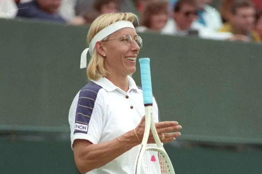Martina Navratilova smiles as she spins her racquet around her hand for the crowd during her match against Laura Garrone of Italy at the Wimbledon championships on June 30, 1991. REUTERS/Andrew Wong