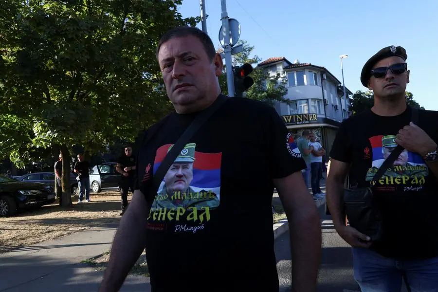 A mourner wearing a t-shirt with a picture of former Bosnian Serb wartime general Ratko Mladic reacts as people gather at the Church of St. Luke, where Mladic's body lies in state before burial, in Belgrade, Serbia, September 7, 2026. REUTERS/Zorana Jevtic