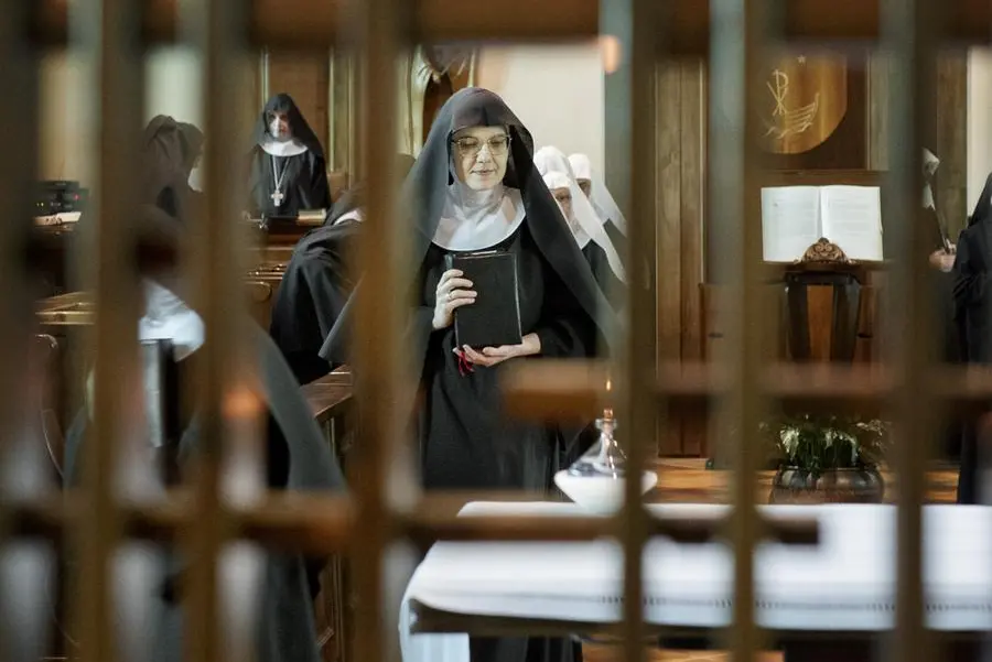 The nuns take their places in the choir for Compline, the last prayer of the day