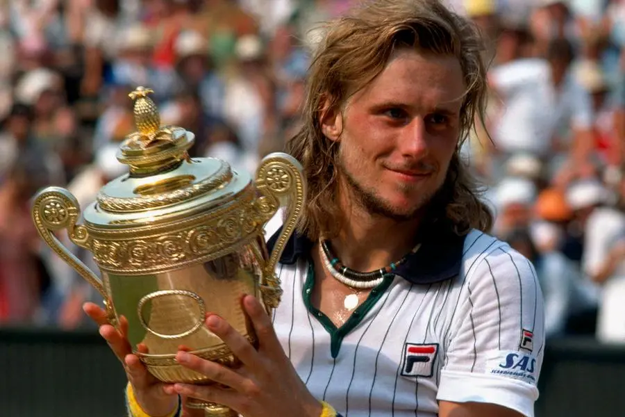 Jun 30, 1976; London, England: Bjorn Borg (SWE) hoist the Wimbledon trophy. Mandatory Credit: Offside Sports via USA TODAY Sports