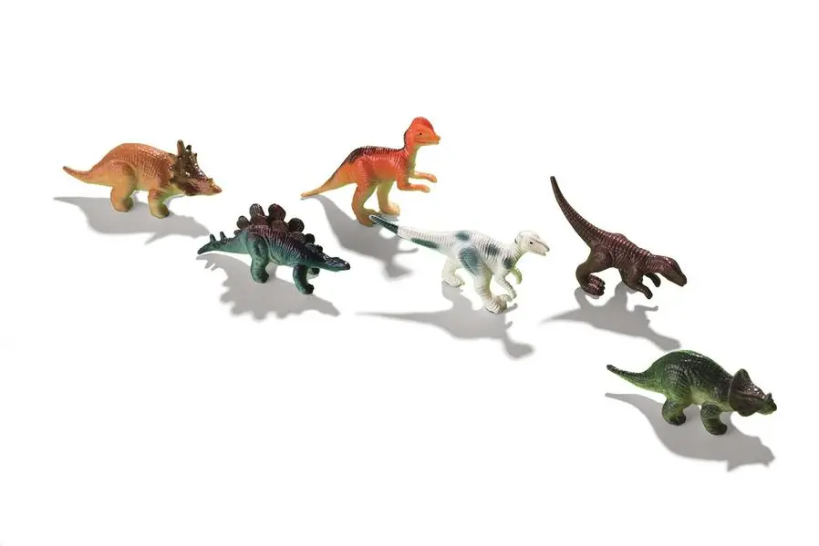 Dinosaur toys on green background