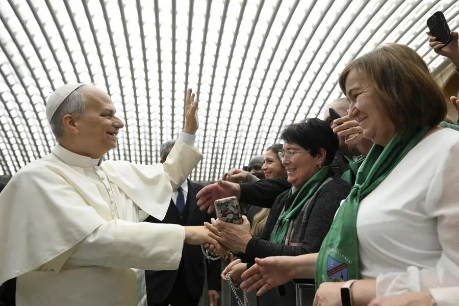 The Pope greeting some faithful