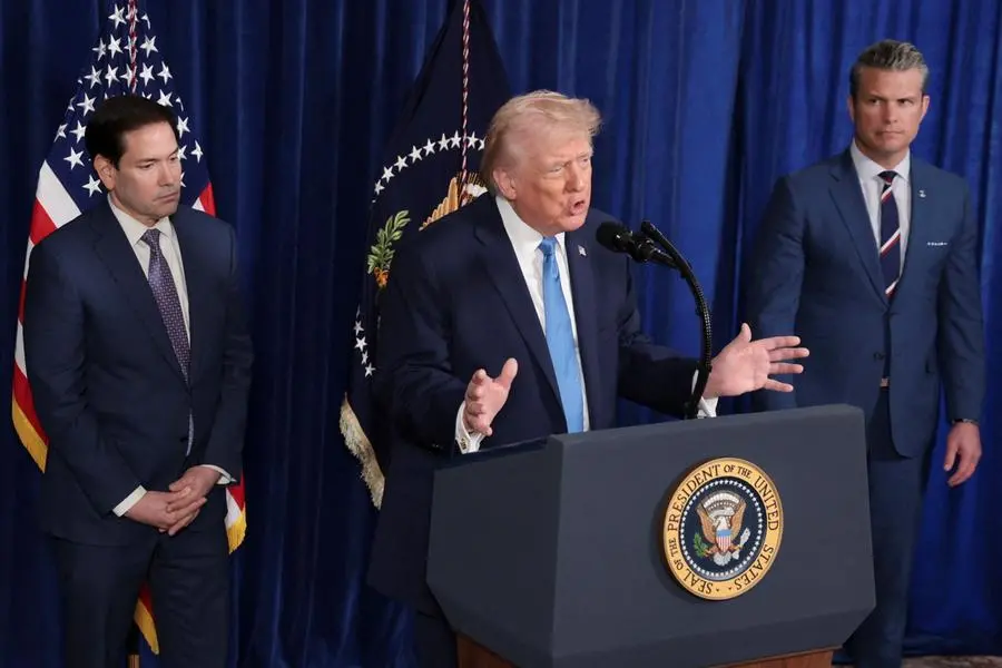 US President Donald Trump speaks as Secretary of Defense Pete Hegseth and US Secretary of State Marco Rubio look on during a press conference following a US strike on Venezuela where President Nicolas Maduro and his wife, Cilia Flores, were captured, from Trump's Mar-a-Lago club in Palm Beach, Florida, US, January 3, 2026. REUTERS/Jonathan Ernst