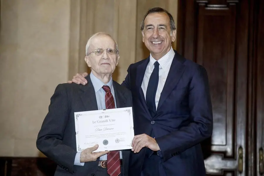 Mayor Giuseppe Sala rewards Dan Peterson during the awards ceremony \"A Great Life\" as part of the Milan Longevity Summit at Palazzo Marino in Milan, 14 March 2025.