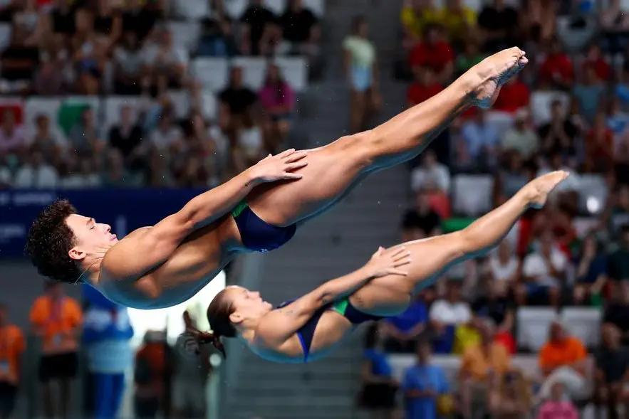 Diving - European Aquatics Championships - Paris Aquatic Centre, Paris, France - August 2, 2026 Italy's Matteo Santoro and Chiara Pellacani in action during the Mixed Synchronised 3m Springboard Final REUTERS/Gonzalo Fuentes