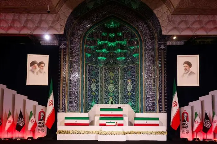 The coffins of Iran's slain supreme leader Ali Khamenei and his family members are pictured at the Grand Mosalla in Tehran on July 3, 2026. The body of Iran's supreme leader Ali Khamenei, who was killed in US-Israeli strikes, arrived at Tehran's Grand Mosalla religious complex ahead of his funeral, state media reported on July 3. The body of Iran's supreme leader who was killed in US-Israeli strikes that triggered the Middle East war arrived at Tehran's Grand Mosalla on Friday ahead of his funeral, state media reported. Millions of people and a coterie of foreign dignitaries were expected to attend July 4 official ceremony for Ali Khamenei, with Tehran's chief negotiator calling for a massive turnout to avenge his death. (Photo by Atta KENARE / AFP) /