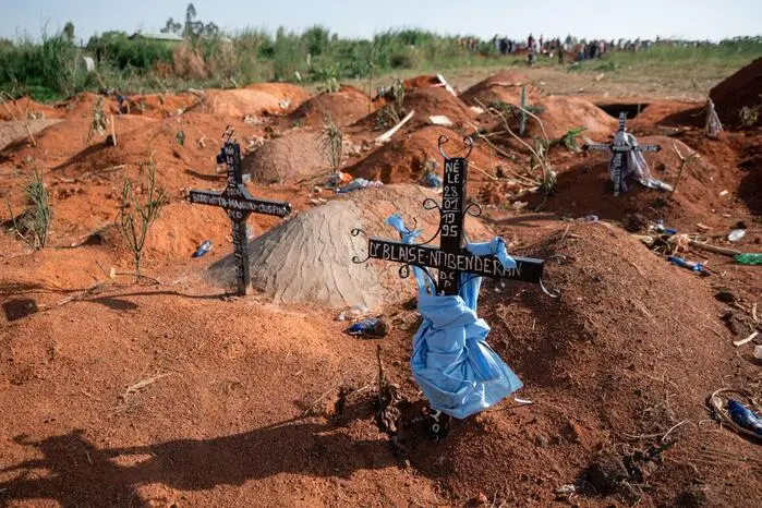 (FILES) General view of Nyamurongo cemetery, located in Ndibakodu neighborhood, one of the burial sites receiving a large number of people who have died from Ebola virus disease since the beginning of the outbreak, in Bunia, Ituri Province, Democratic Republic of the Congo, on June 13, 2026. An Ebola outbreak in the Democratic Republic of Congo has killed 2,011 people out of 4,381 confirmed cases of the virus, Congolese officials said on Tuesday. The latest toll for the disease, which has hit the DRC's conflict-plagued eastern and northeastern regions, puts it close behind the country's deadliest Ebola outbreak in 2018 to 2020 when nearly 2,300 people died. (Photo by Jospin Mwisha / AFP)