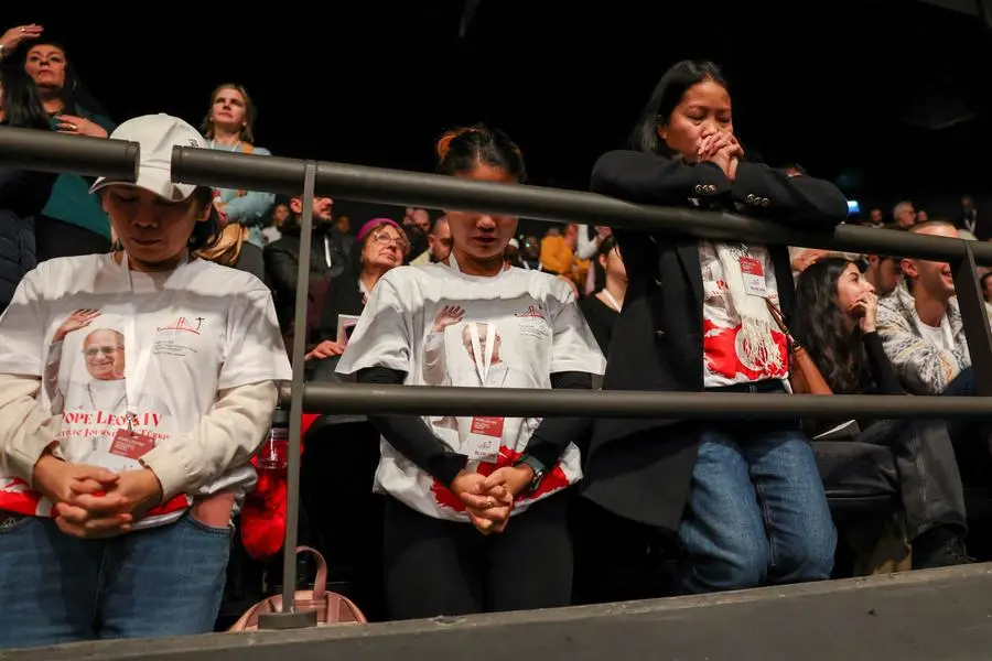 Faithful in prayer during the Pope's Mass at the Volkswagen Arena in Istanbul
