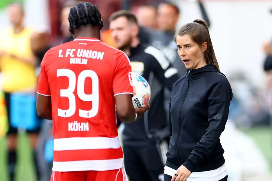 Soccer Football - Bundesliga - 1. FC Union Berlin v VfL Wolfsburg - Stadion An der Alten Forsterei, Berlin, Germany - April 18, 2026 1. FC Union Berlin interim coach Marie-Louise Eta and Derrick Kohn REUTERS/Lisi Niesner DFL REGULATIONS PROHIBIT ANY USE OF PHOTOGRAPHS AS IMAGE SEQUENCES AND/OR QUASI-VIDEO.