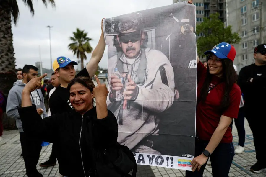 SENSITIVE MATERIAL. THIS IMAGE MAY OFFEND OR DISTURB A woman reacts as Venezuelans living in Chile gather to celebrate, after the United States struck Venezuela and captured its President Nicolas Maduro and his wife Cilia Flores overnight, in Concepcion, Chile, January 3, 2026. REUTERS/Juan Gonzalez TPX IMAGES OF THE DAY