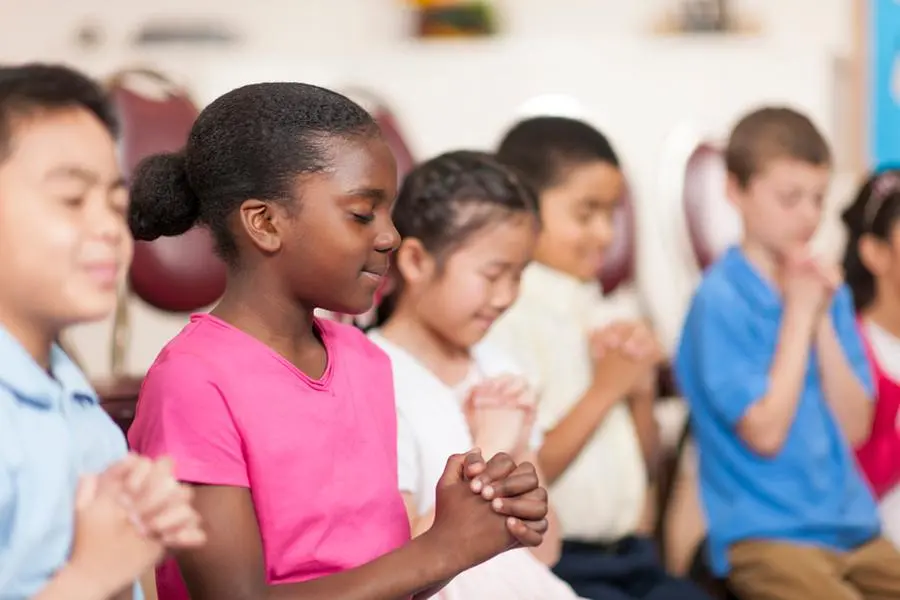 Kids reading the bible in Sunday School. , Getty Images