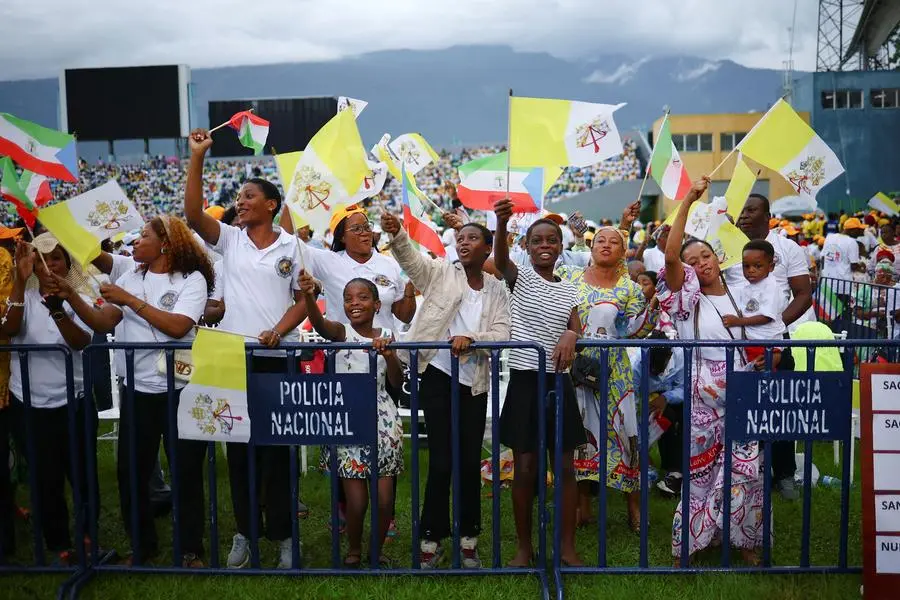 People gather for a holy Mass by Pope Leo XIV at Malabo Stadium, on the last day of his apostolic journey, in Malabo, Equatorial Guinea, April 23, 2026. REUTERS/Guglielmo Mangiapane