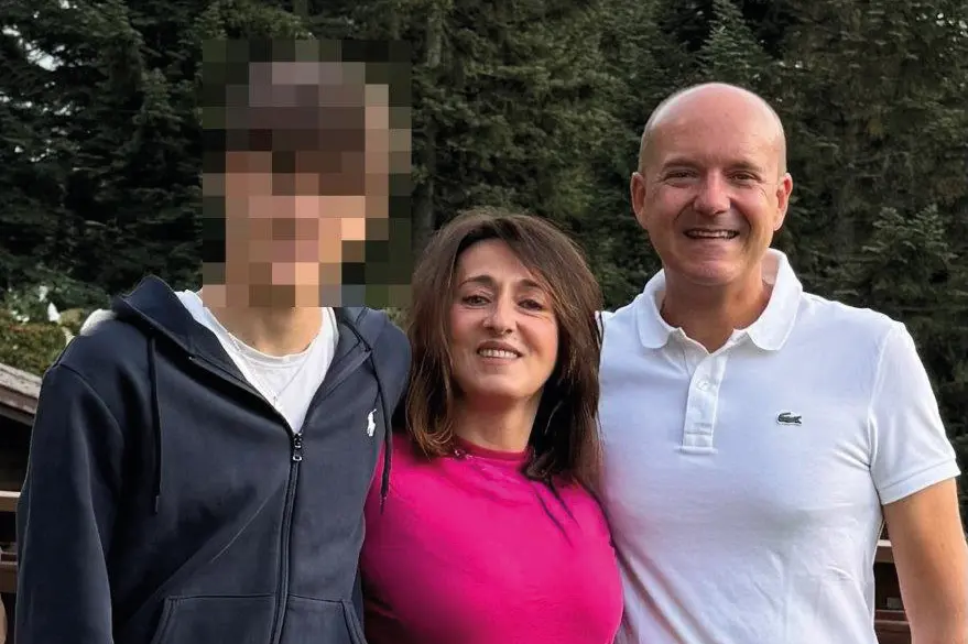 Giuseppe Giola, 16 years old, with his mother Odette and father Valentino