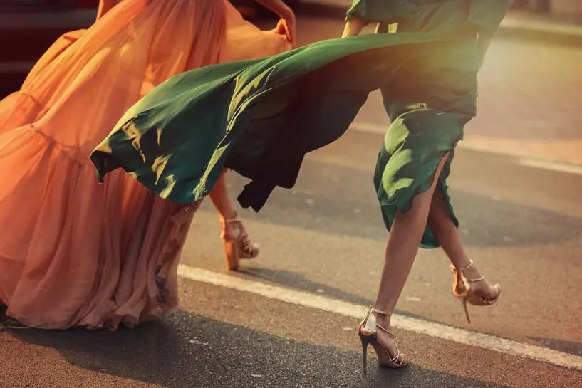 Women wearing elegant dresses, street style detail. , Getty Images/iStockphoto