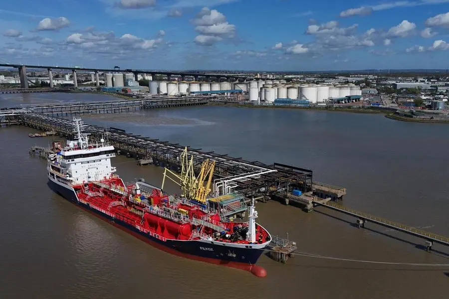 epa12889038 An image made with a drone shows the Maltese registered Flyoz chemical and oil oil tankers delivering to gas and fuel storage units at the Navigator Terminal in Grays, Britain, 14 April 2026. Oil prices have risen above 100 US dollars a barrel again as the US Navy begins a blockade of the Strait of Hormuz following the collapse of ceasefire negotiations between Iran and the United States. Meanwhile, leasing of electric vehicles has surged across Europe amid rising petrol prices linked to the Iran war. EPA/NEIL HALL