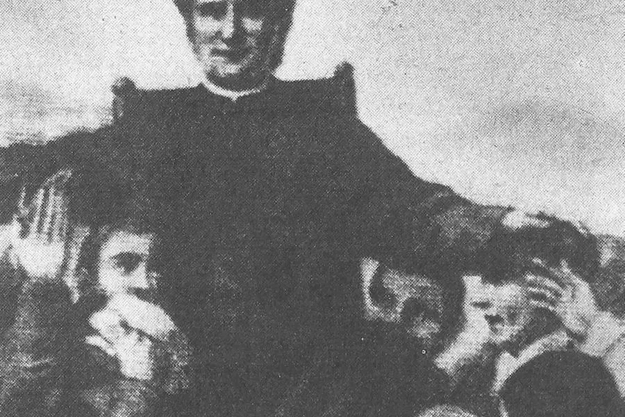 Saint John Bosco among the boys.