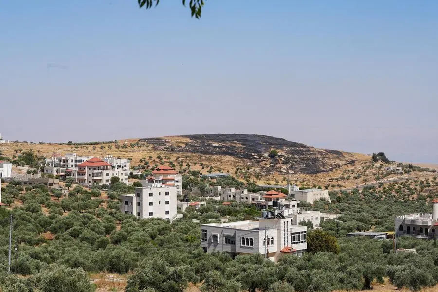 La collina bruciata dietro il villaggio cristiano di Taybeh. , REUTERS