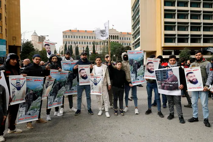 epa12692703 Relatives and families of Islamist prisoners at Roumieh prison carry pictures of their beloved ones during a protest outside the Government palace in downtown Beirut, Lebanon, 30 January 2026. Some of the families of Syrians and Lebanese held in jails gathered to protest after a group of prisoners at Roumieh prison announced an open-ended hunger strike. EPA/WAEL HAMZEH