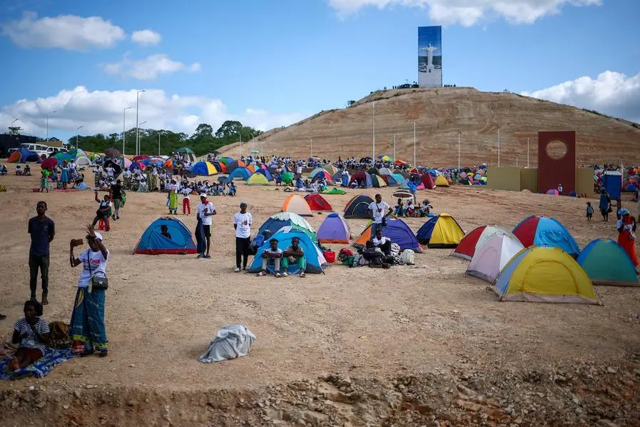 Angolans camped with tents near the sanctuary in Muxima.