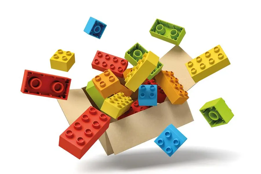 3d rendering of cardboard box in air full of colorful toy bricks which are flying out and floating outside. Children's goods. Toys and games. Toy manufacture.