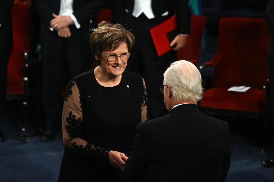 Hungarian biochemist Katalin Kariko receives the 2023 Nobel Prize in Physiology or Medicine from King Carl Gustaf of Sweden.