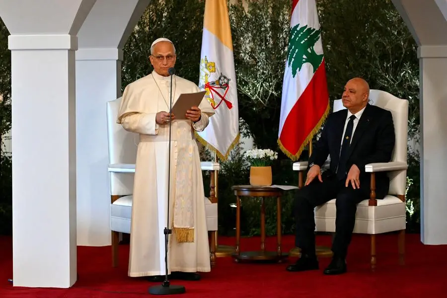 Pope Leo XIV speaks next to Lebanon\\'s President Joseph Aoun during a farewell ceremony before departing from Beirut International Airport at the end of his apostolic journey, in Lebanon December 2, 2025. ANDREAS SOLARO/Pool via REUTERS , via REUTERS