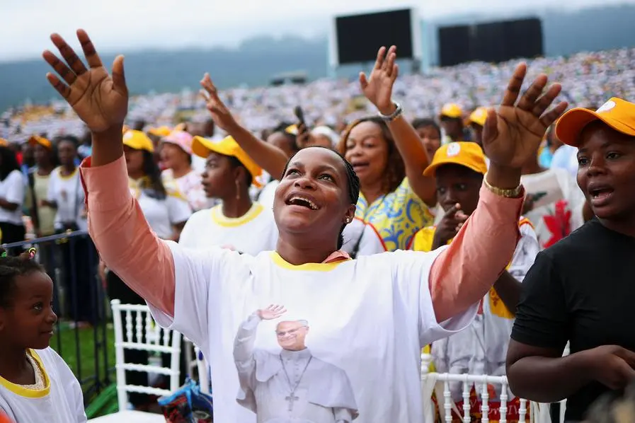 People attend a holy Mass by Pope Leo
