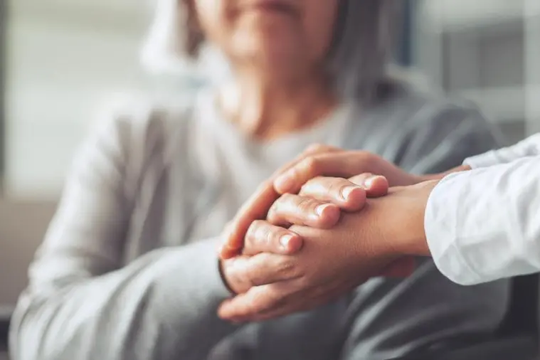 Hands holding old woman\\'s hands , Getty Images