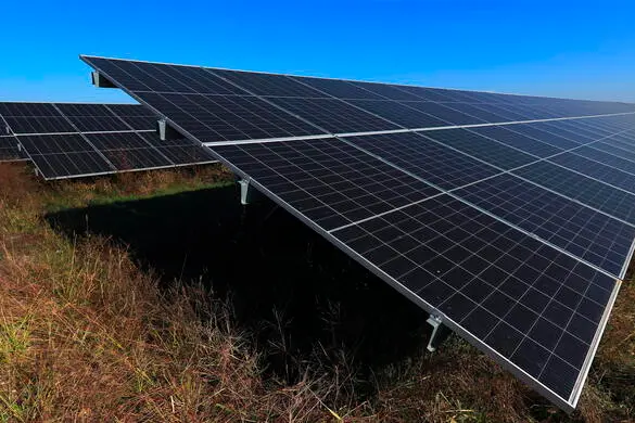 epa10950772 Rows of photovoltaic panels at the new solar park inaugurated in Ratesti village, 100km north-west from Bucharest, Romania, 31 October 2023. Two Israeli energy companies, Nofar and EcOnergy, united their efforts to build the largest photovoltaic park in South-East Europe, starting in 2012. The 154MW photovoltaic power plant project, located in Ratesti village, Southern Romania, is the largest of its kind in Romania and is forecast to generate an annual 124GWh a year, powering 100,000 households with clean energy while cutting carbon emissions by 160,000 tons. EPA/ROBERT GHEMENT