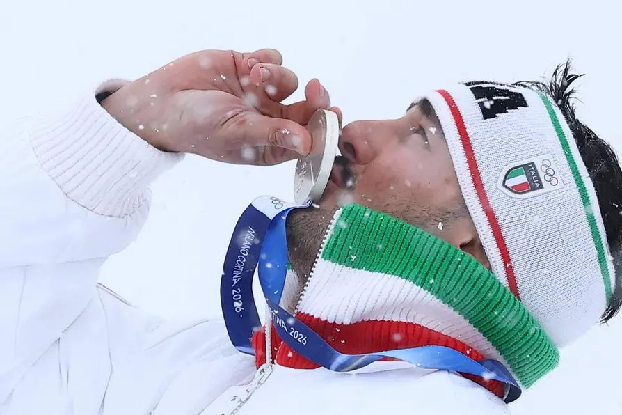 Milano Cortina 2026 Olympics - Freestyle Skiing - Men\\'s Ski Cross Victory Ceremony - Livigno Snow Park, Livigno, Italy - February 21, 2026. Silver medallist Federico Tomasoni of Italy celebrates on the podium during the men\\'s ski cross victory ceremony REUTERS/Gonzalo Fuentes , REUTERS