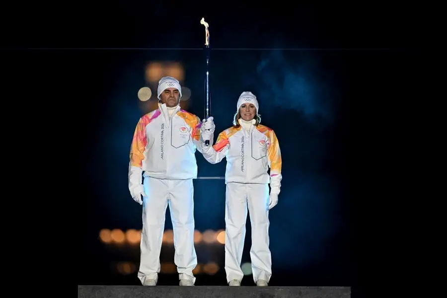 epa12711216 Alberto Tomba and Deborah Compagnoni on their way to the cauldron at the Arco della Pace in central Milan during the opening ceremony for the Milano Cortina 2026 Winter Olympic Games in Milan, Italy, 06 February 2026. EPA/CARL SANDIN / POOL